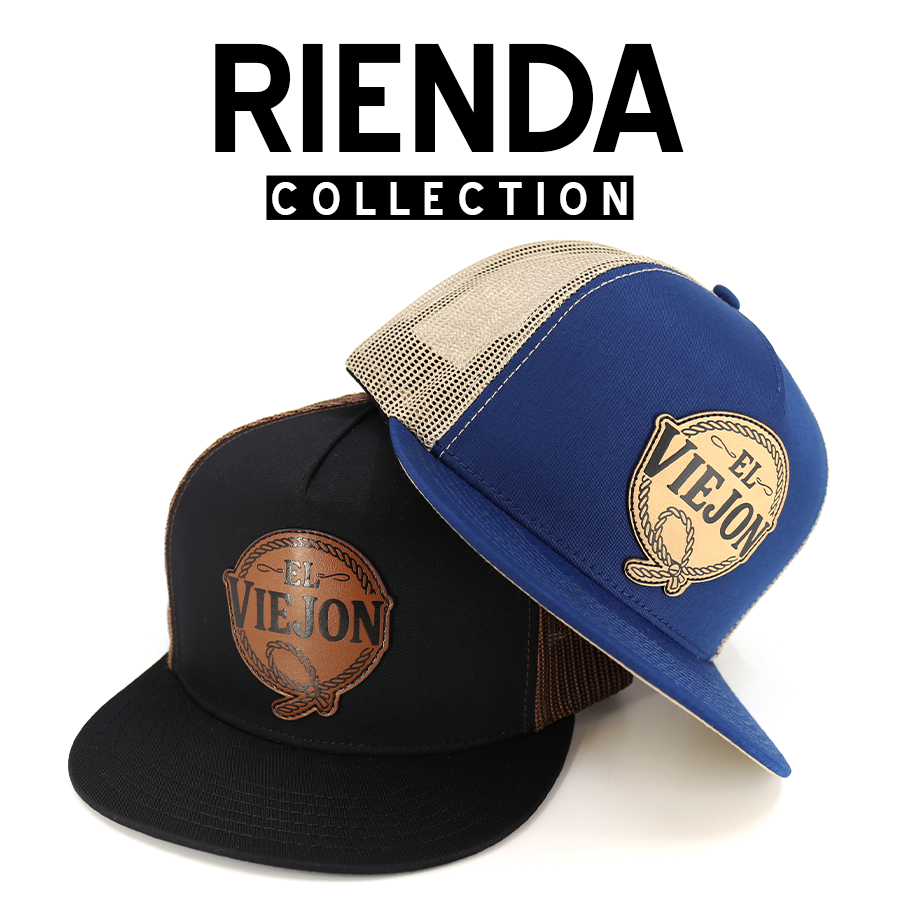 Rienda Collection: Two trucker hats, one black and one blue, with "El Viejon" leather patch.