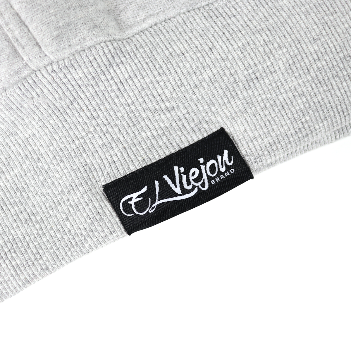Close-up of a gray heather cotton/poly fleece hoodie with a black "El Viejou Brand" label.