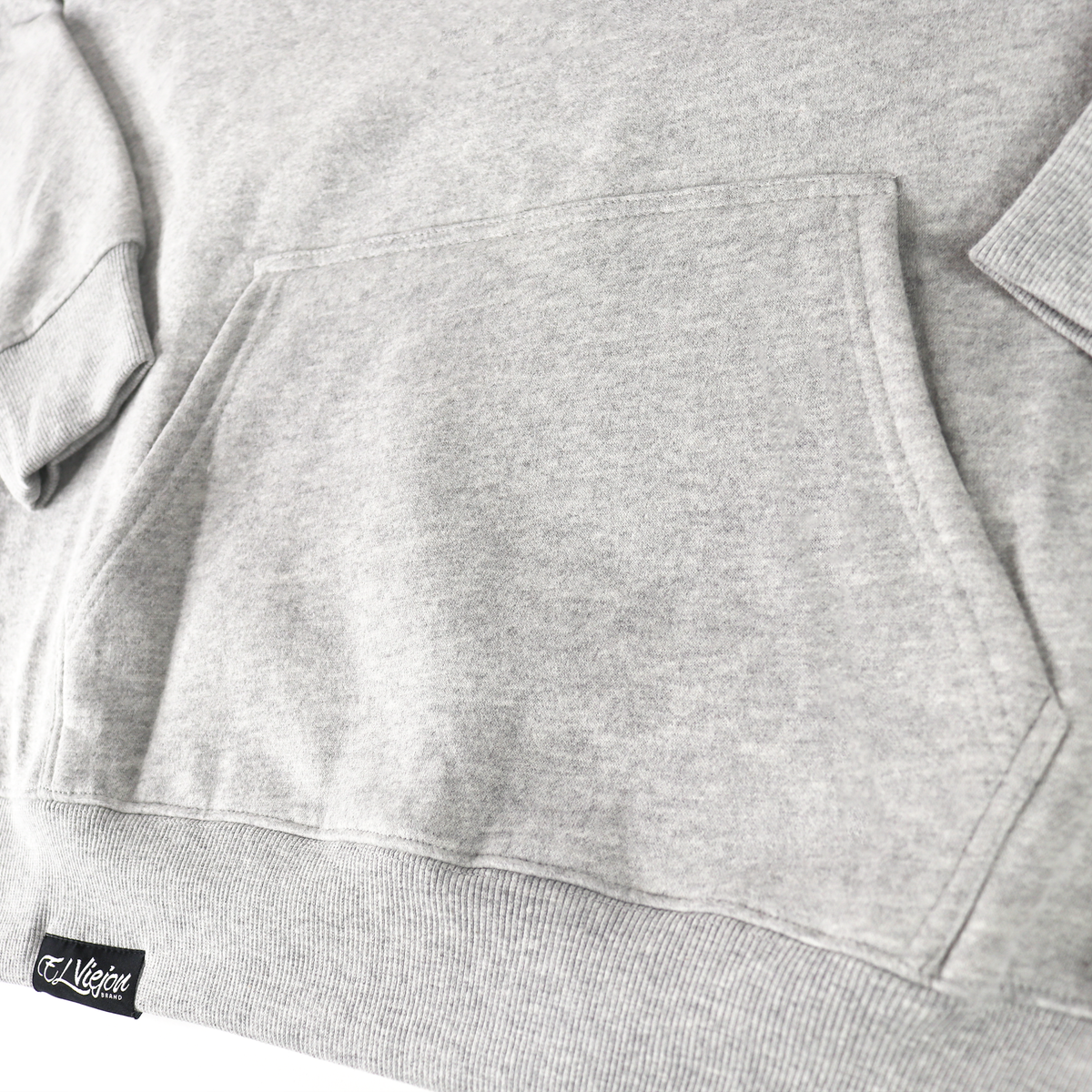 Origen heather cotton/poly fleece hoodie with front pocket and "El Viejon" logo tag.