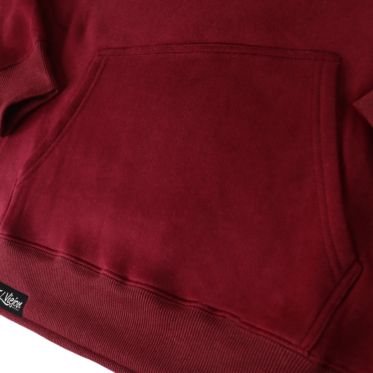 Maroon cotton/poly fleece hoodie with front pocket and screen-printed logo.