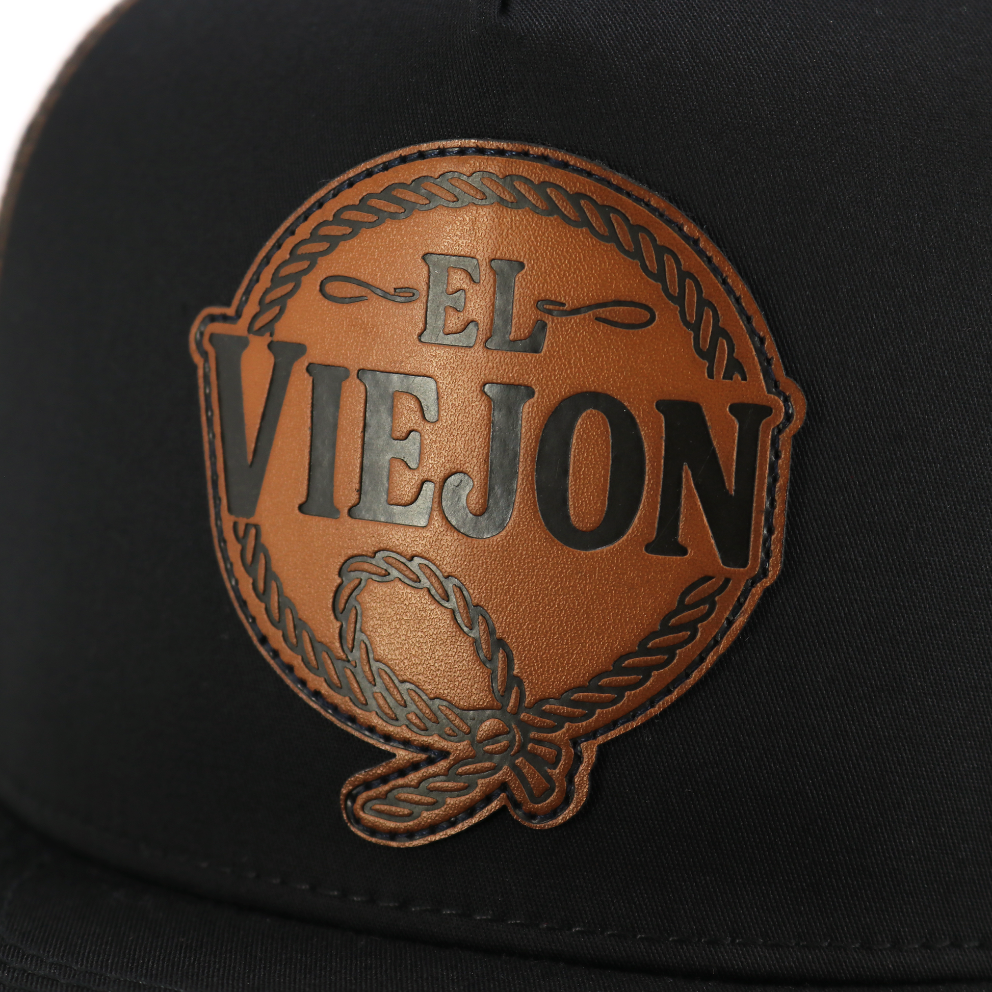 Rienda Black/Brown flat visor hat with "EL VIEJON" brown leather patch and rope detail.