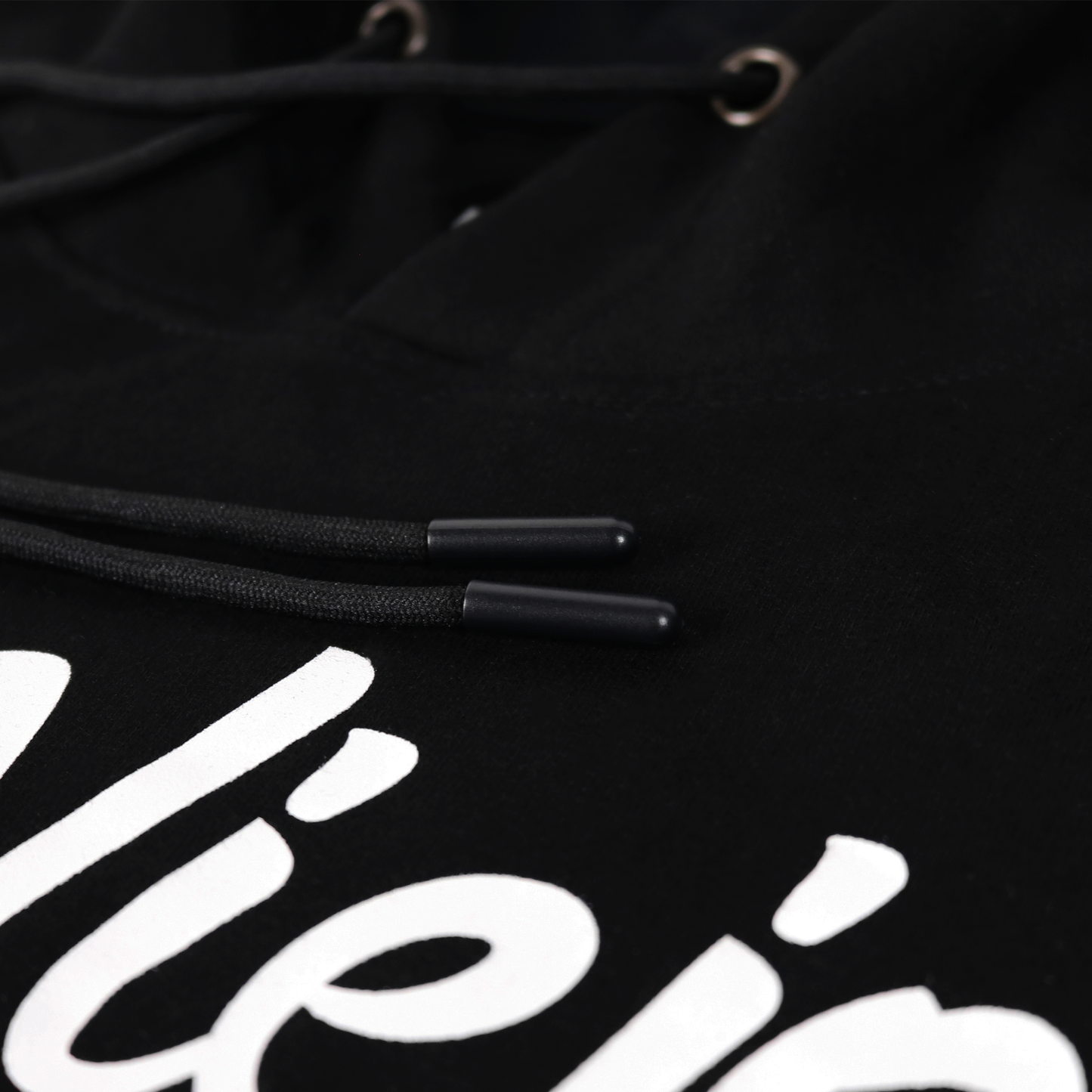 Black cotton/poly fleece hoodie with white screen-printed logo, drawstrings, and front pocket detail.
