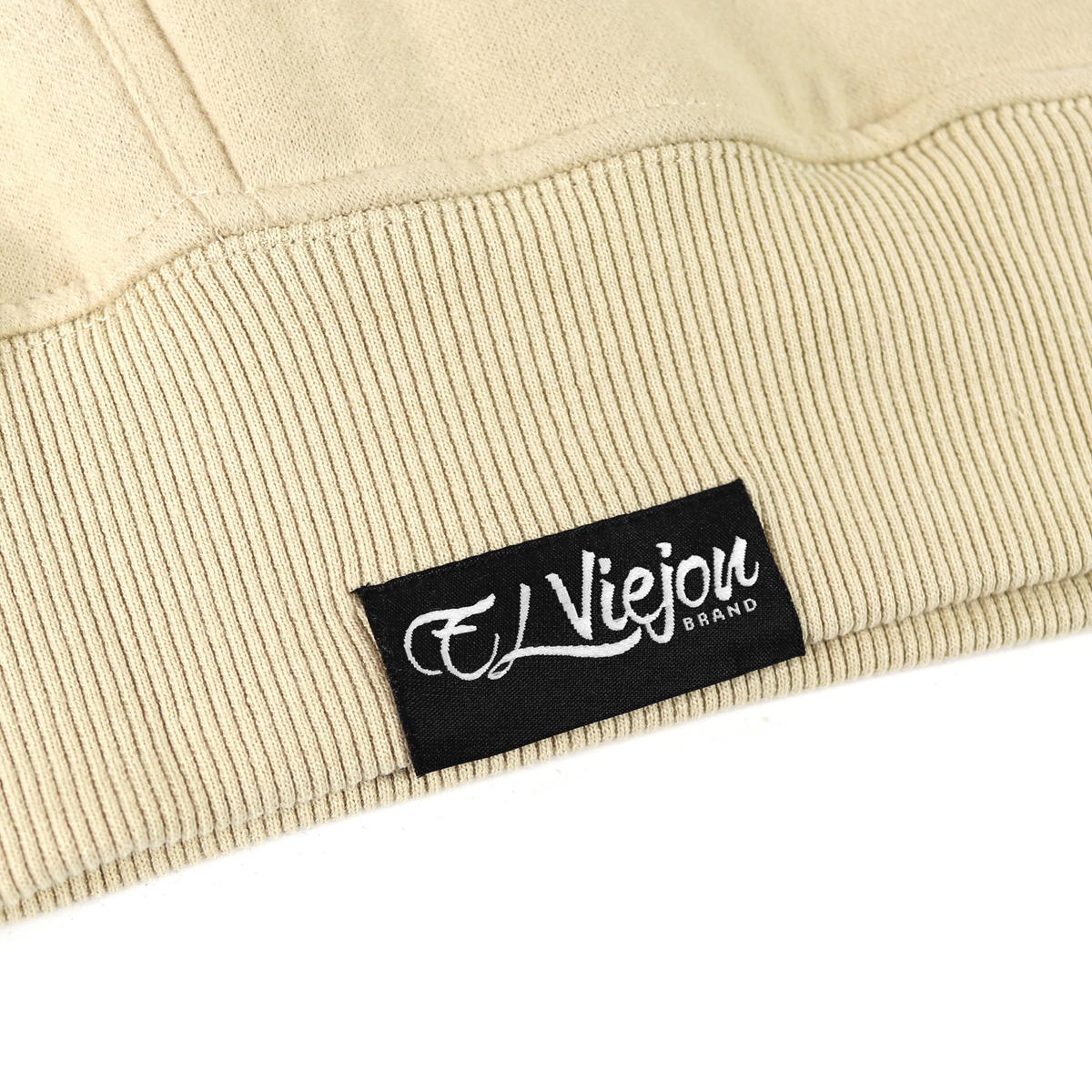 Close-up of a sand-colored cotton/poly fleece hoodie with a black "El Viejou Brand" label.
