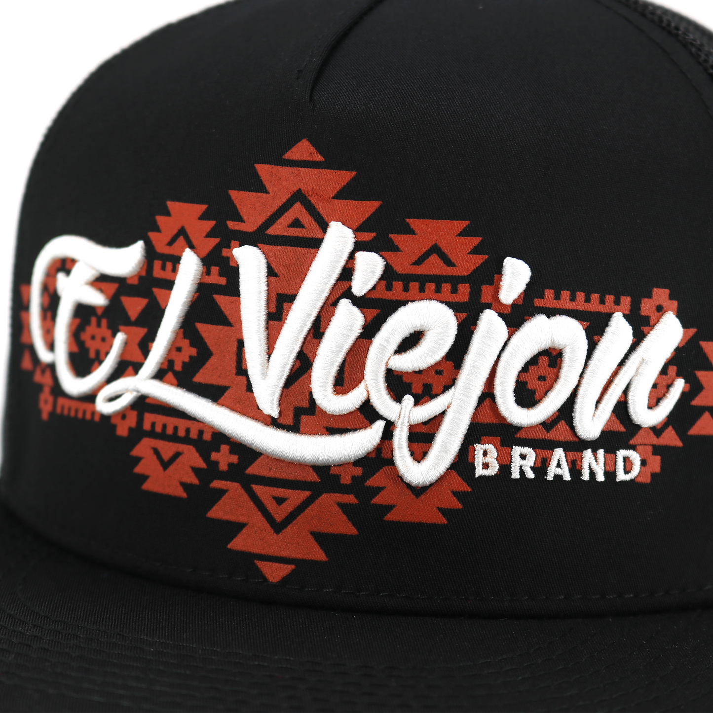 Black flat visor hat with "El Viejon Brand" in white embroidery over a red Aztec pattern.